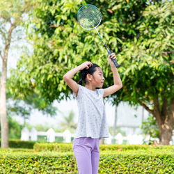 Girl playing badminton at park