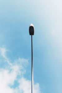 Low angle view of street light against sky