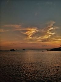 Scenic view of sea against sky at sunset