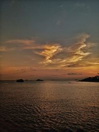 Scenic view of sea against sky at sunset