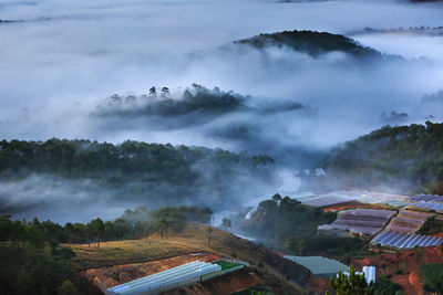 Scenic view of mountains during foggy weather