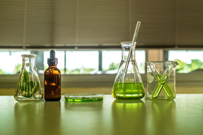 Close-up of laboratory glassware on table 