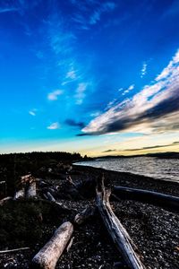 Scenic view of railroad tracks against blue sky