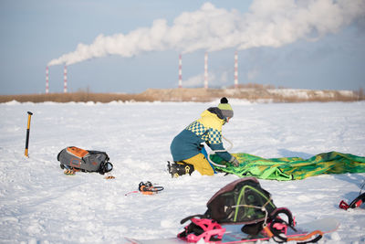 People skiing on snow covered mountain