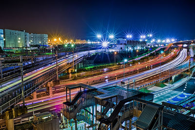 High angle view of light trails on street against sky