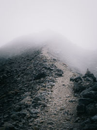 Fog covering mountain during winter