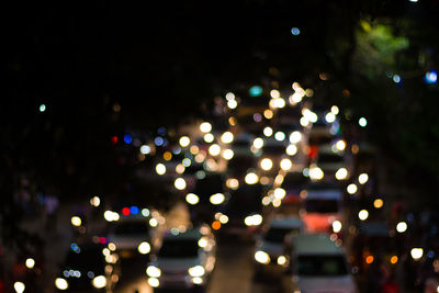 Defocused image of illuminated christmas tree at night