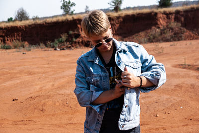 Full length of senior woman standing on land