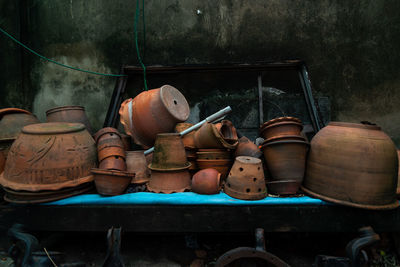 Stack of earthen containers for sale at market stall