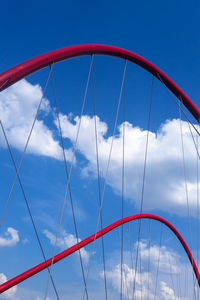 Low angle view of bridge against blue sky