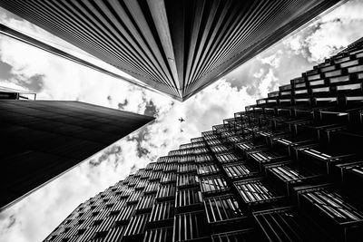 Low angle view of building against cloudy sky