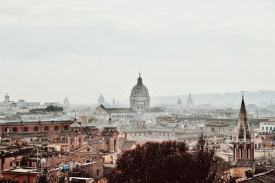 Buildings in city against sky