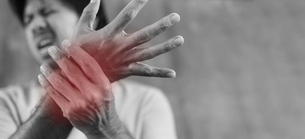 Close-up of person hand against blurred background