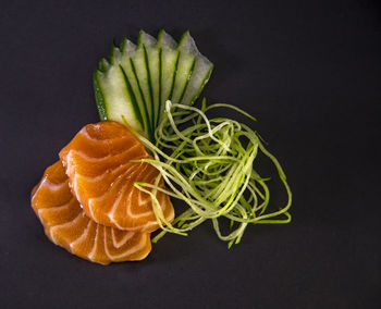 Close-up of chopped fruit against black background