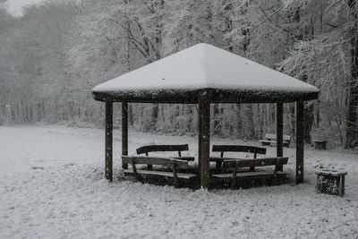 Lifeguard hut on snow covered landscape