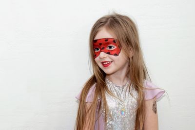 Portrait of happy girl against white background