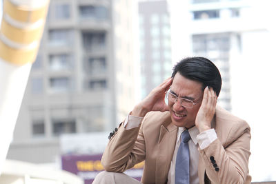 Businessman suffering from headache