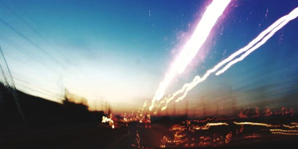 Panoramic view of illuminated city against sky at night