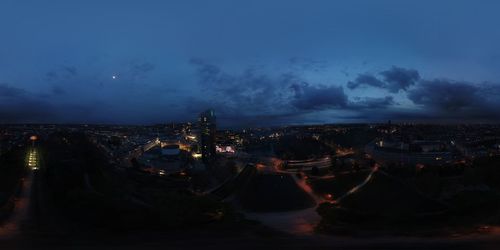 High angle view of city lit up at night