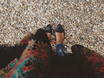 Close-up of woman standing on tiled floor