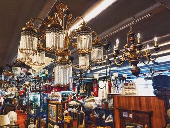 Low angle view of illuminated lanterns hanging in building