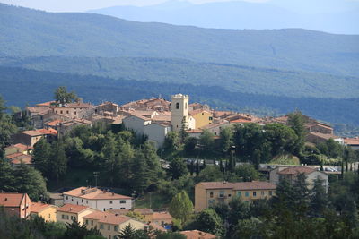 High angle view of townscape and mountains