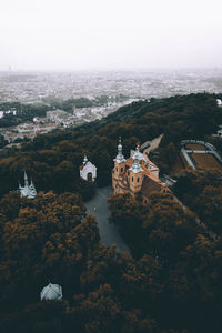 High angle view of trees and buildings against sky