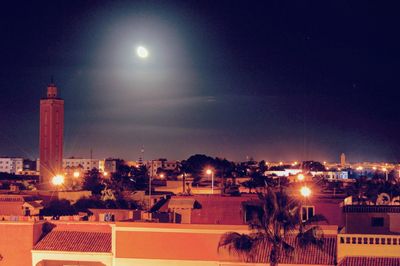 View of illuminated town against sky at night