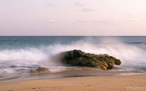 Scenic view of sea against clear sky