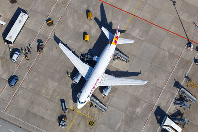 High angle view of airplane on airport runway