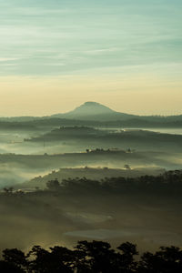 Scenic view of mountains against sky during sunset