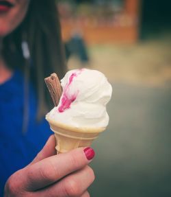 Close-up of hand holding ice cream