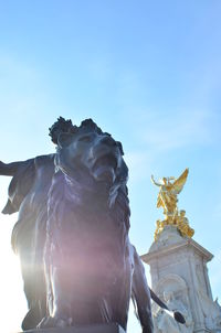 Low angle view of statue against sky