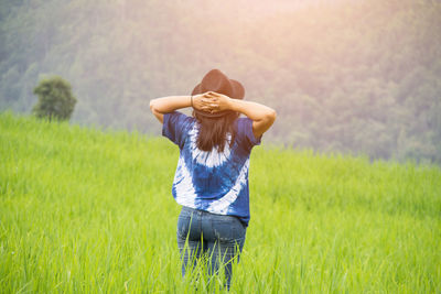 Woman standing on field