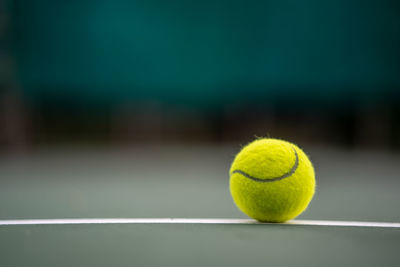 Close-up of tennis ball on field