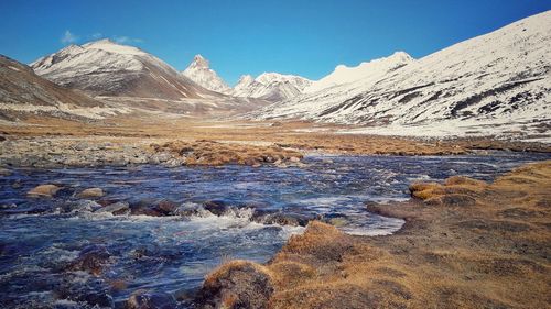 Scenic view of mountains against sky during winter