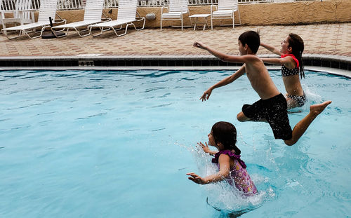 People enjoying in swimming pool