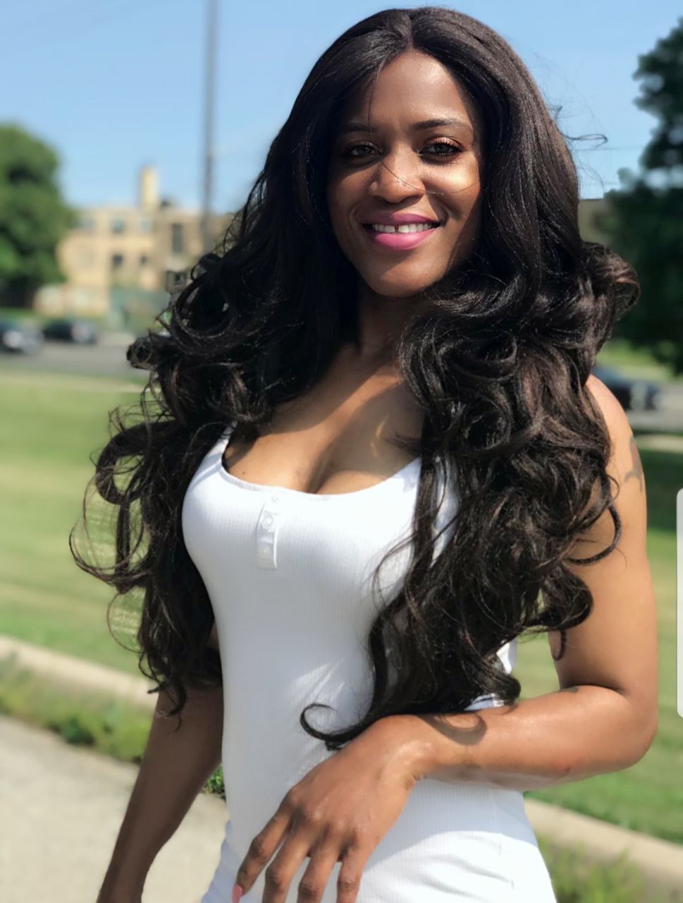 long hair, hair, young women, hairstyle, looking at camera, smiling, young adult, happiness, portrait, one person, focus on foreground, three quarter length, beauty, real people, women, leisure activity, standing, lifestyles, beautiful woman, day, black hair, fashion, outdoors