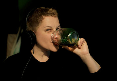 Portrait of man drinking glass