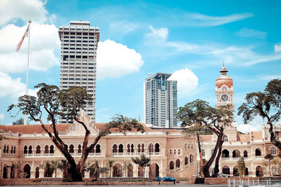 View of city against cloudy sky