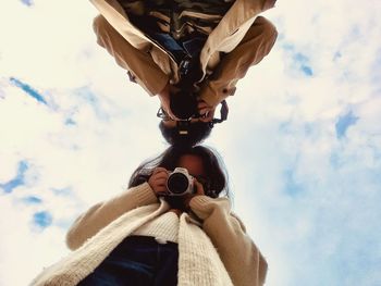 Low angle view of man against sky