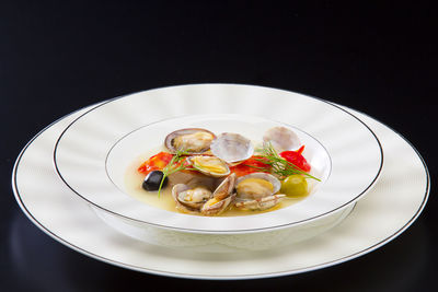 High angle view of meal served in plate on black background