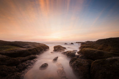 Scenic view of sea against sky during sunset