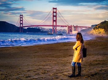 Woman looking at golden gate bridge