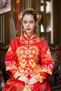 Portrait of beautiful young woman in traditional clothing