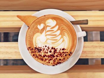 Close-up of cappuccino on wooden table