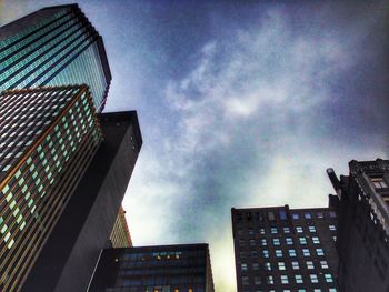 Low angle view of building against cloudy sky