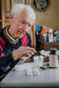 Portrait of man working on table