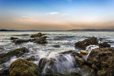 Scenic view of sea against cloudy sky