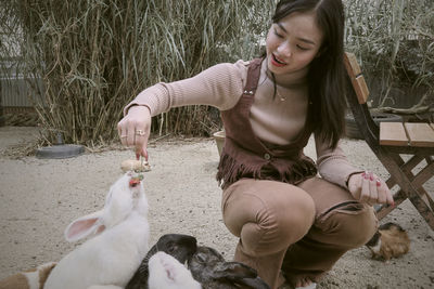 Portrait of young woman with dog